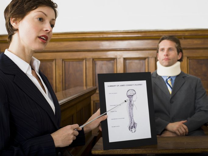 Stephen C. Carter, PC Attorney at Law | Hartwell, GA | attorney pointing at evidence in front of victim in courtroom